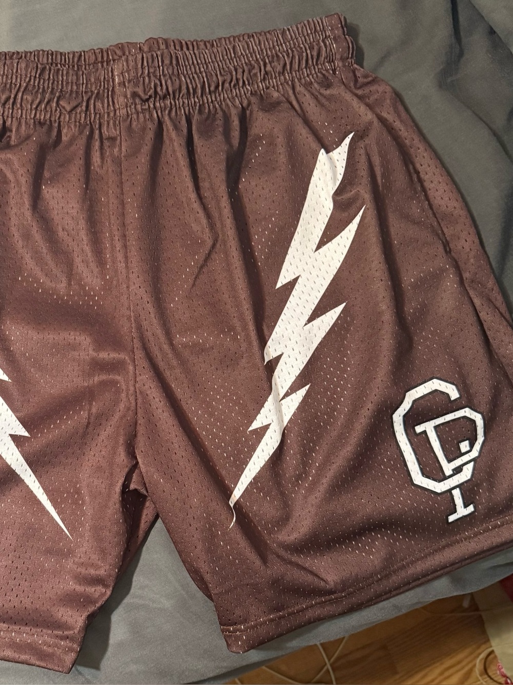 Men's Brown Athletic Mesh Shorts with White Lightning Accent